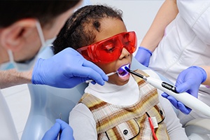 Child receiving dental sealants