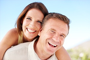 Smiling older man and woman outdoors