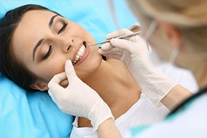 Woman receiving dental treatment