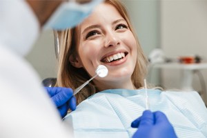 A young woman in the dentist chair having her teeth checked